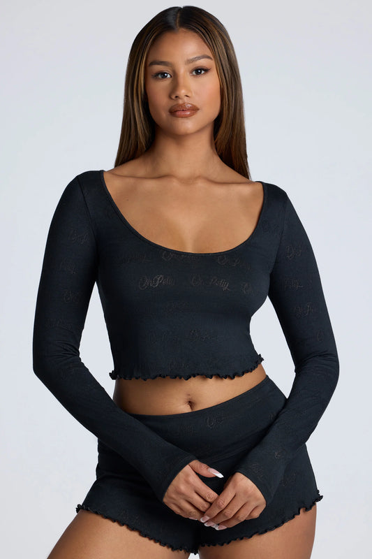 Long Sleeve Scoop Neck Pointelle Crop Top in Black