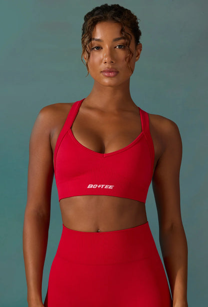 Super Sculpt Seamless Cross Back Sports Bra in Tango Red