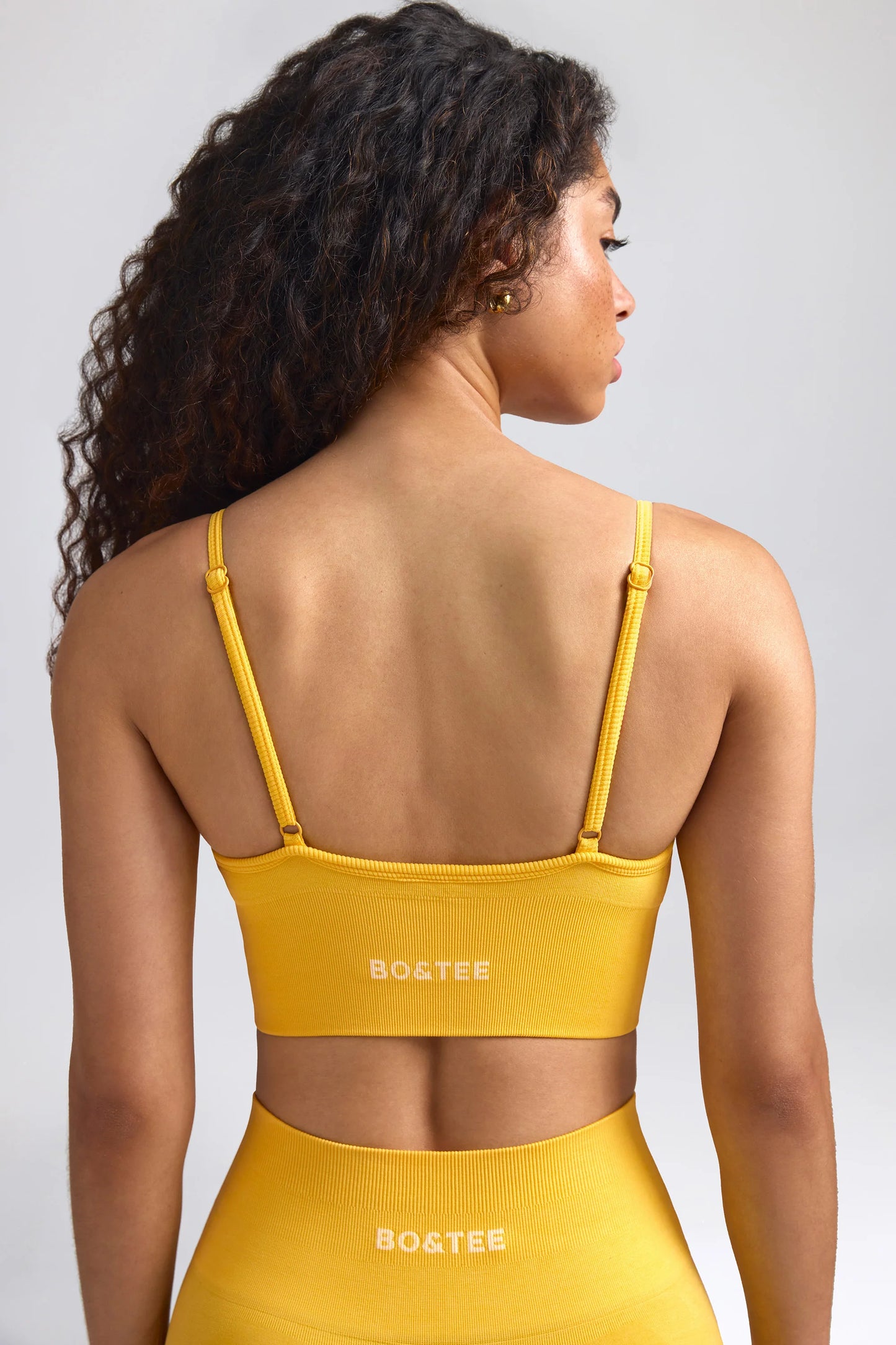 Define Luxe V-Neck Sports Bra in Golden Yellow